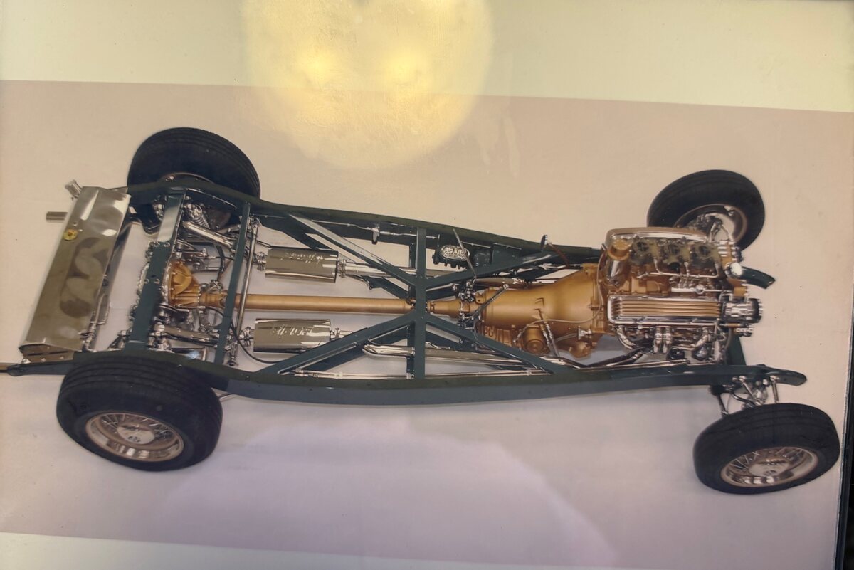 Bare rolling chassis showing Heidts independent suspension, drivetrain, and dual exhaust