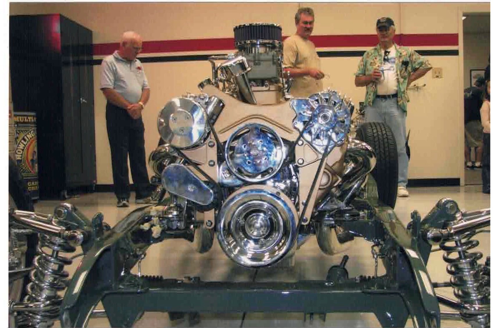 Chrome-dressed engine on display with onlookers